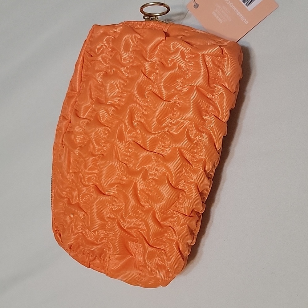 Bright orange Ulta Makeup bag